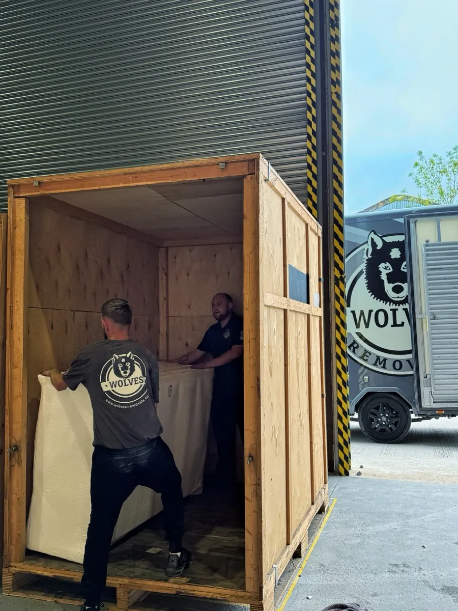 Wolves team loading a storage container
