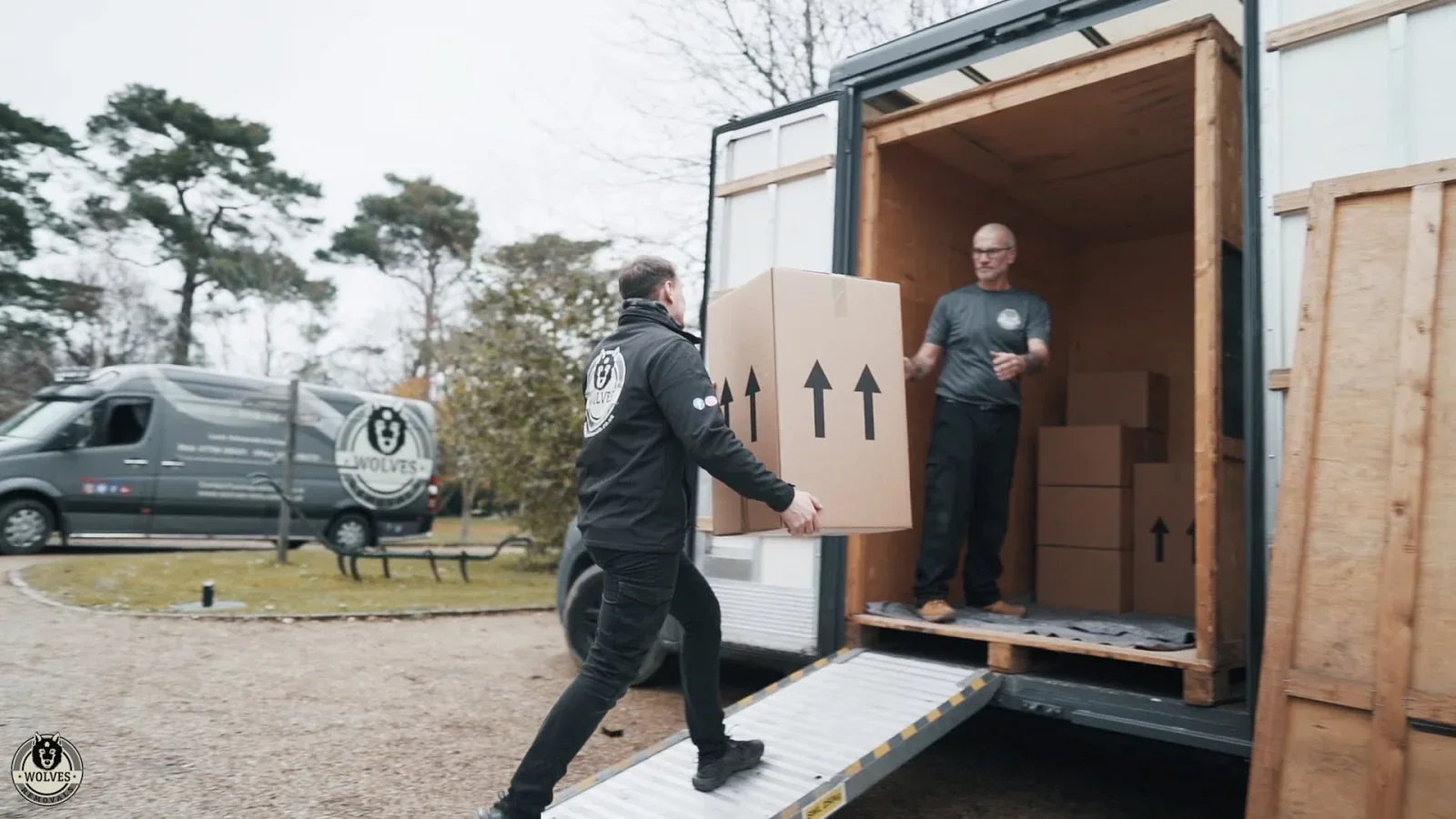 Wolves Storage Sussex movers loading packed boxes up the ramp into the van