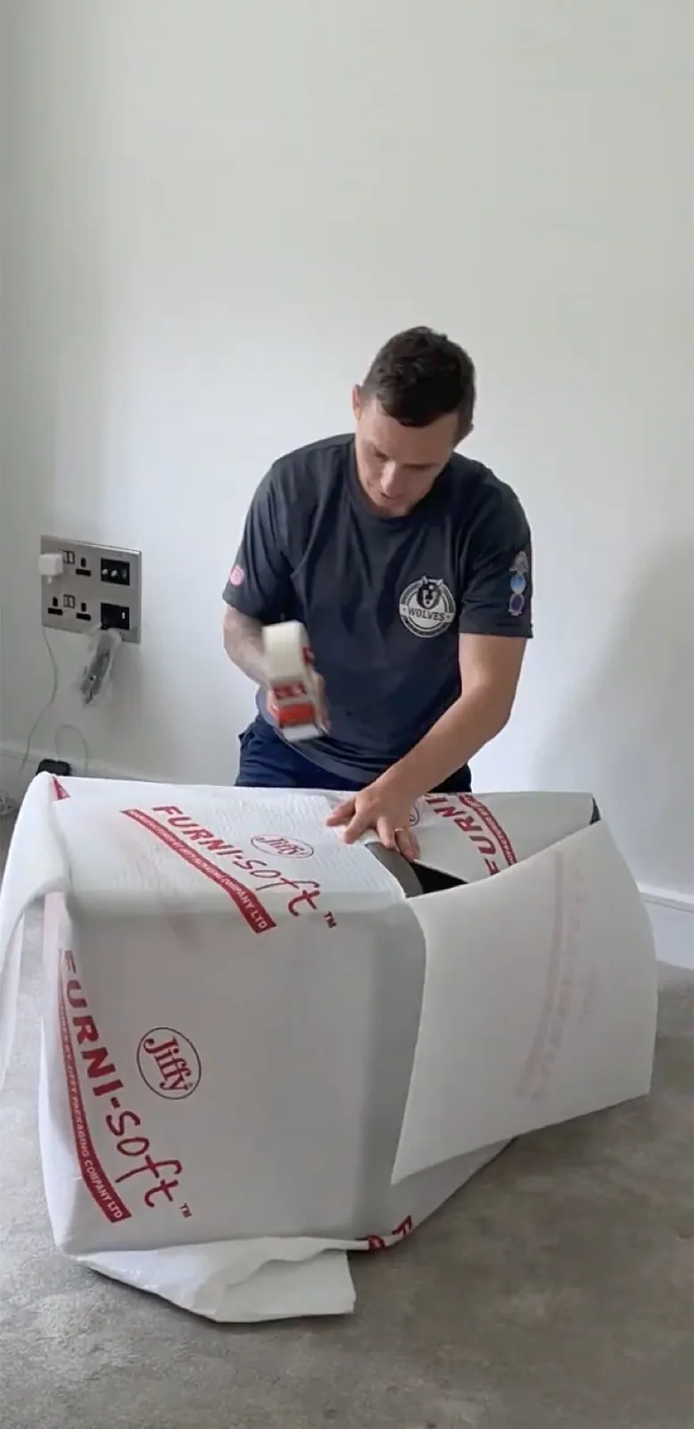 Wrapping furniture in Furni-soft padding before sealing it into a storage container &mdash; Wolves Storage Sussex serving Pulborough