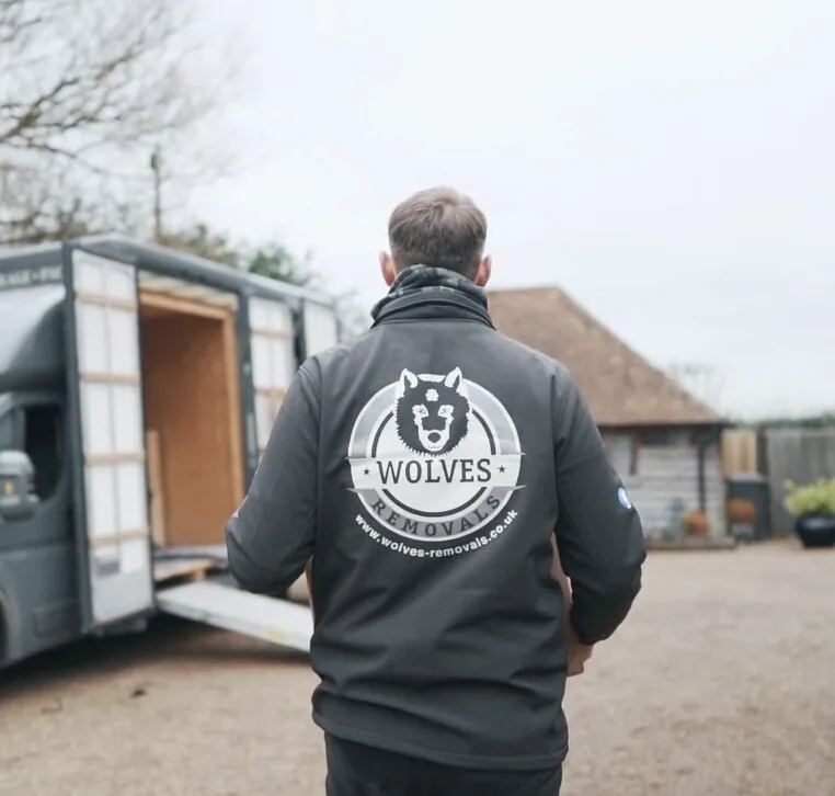 A Wolves Storage Sussex team member loading the Luton van during a door-to-door collection &mdash; serving Henfield